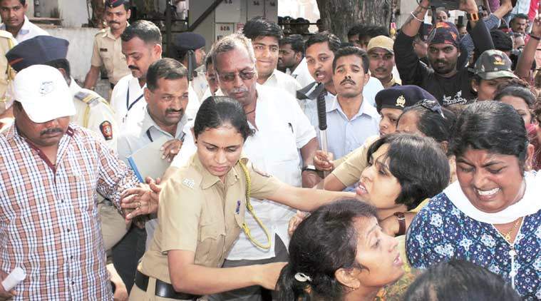 Trupti Desai, leader of the Bhumata Brigade, being dragged away by police during an attempt to offer prayers at the Shani Shingnapur temple. (The Indian Express Photo) 